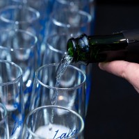 Person pouring champagne